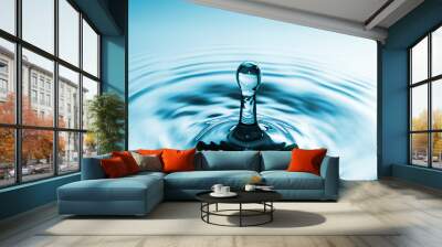 Closeup Water drop falling on the surface of the water and beautiful circular wave ripple, fresh natural mineral water drink water concept Wall mural