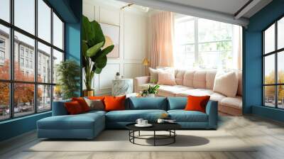 Modern living room with pink sofa, gold accents, and large window. Wall mural