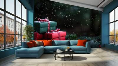 Three Christmas presents wrapped in red and green paper with a snowy background. Wall mural