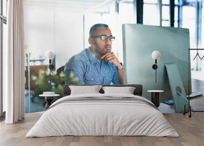 Business man, thinking and computer at desk in office for online research, reading email or report. Male entrepreneur person with internet connection for feedback, review and focus on project Wall mural