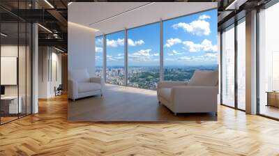 A large window in a room with two white chairs facing the city Wall mural