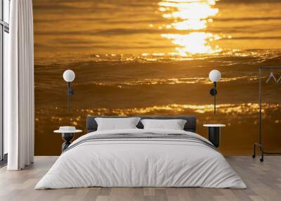 Sunset over the waves Wall mural