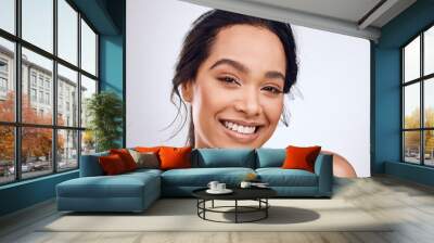 Beauty, makeup and portrait of woman isolated on a white background for happy skincare, cosmetics and glow or shine. Face of young studio model or person from Brazil in natural makeup or dermatology Wall mural