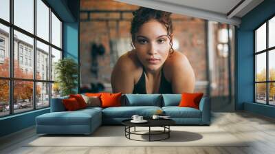 Fitness, exercise and portrait of a woman at gym for a workout and training for healthy lifestyle and body wellness. Face of sports female or athlete at health club for balance, energy and power Wall mural