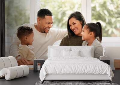 Our kids are happy at their school. Shot of a young family doing homework together at home. Wall mural