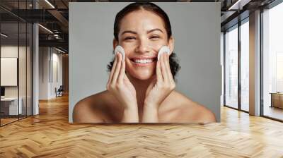 Skincare, beauty and portrait of a woman with cotton for face acne, cosmetic cleaning and dermatology glow on a studio background. Cosmetics, happy and model with clean pads for facial wellness Wall mural