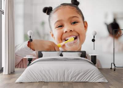 Toothbrush, brushing teeth and face of a child in a home bathroom for dental health and wellness. Smile portrait of african girl kid cleaning mouth with a brush for morning routine and oral self care Wall mural