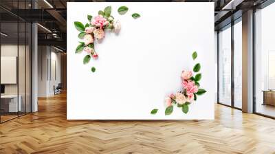 Border frame with pink rose flower buds branches isolated on white background. Flat lay, top view. Floral background. Floral frame. Frame of flowers. Wall mural