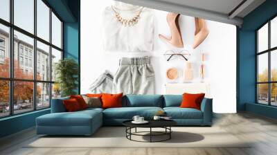 Woman clothes and accessories set on white background top view. modern and casual outfit. fashion, shopping and makeup concept. Flat lay, top view.  Wall mural