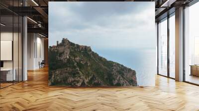 The panoramic view of a medieval fortified castle of an old French village named Èze on top of a cliff and the Mediterranean sea Wall mural