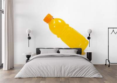 Bottle of fresh orange drink on white background Wall mural