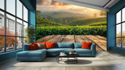 Empty rustic table with tea plantation background at sunrise Wall mural