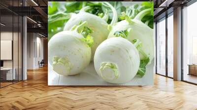 Fresh kohlrabi vegetables with leaves on white table Wall mural