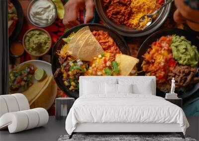 Top view of a group of people eating Mexican tacos on the table Wall mural