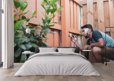 Men painting a fence at ​backyard Wall mural