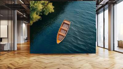 empty wooden boat on blue lake or river , top view Wall mural