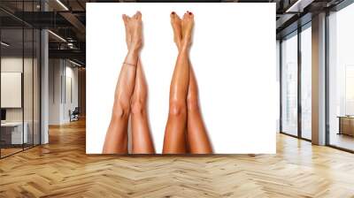 two beautiful pairs of smooth woman's legs after laser hair removal on the white background Wall mural