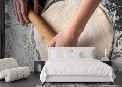 Making dough by female hands at bakery Wall mural