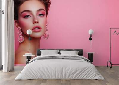 Beauty portrait, model with pink makeup and earrings Wall mural