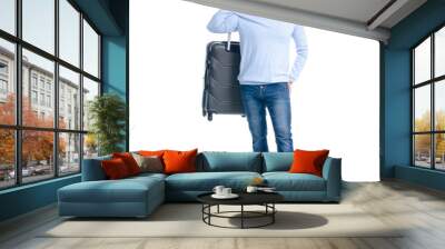 Man in jeans holding travel suitcase standing on white background isolation Wall mural