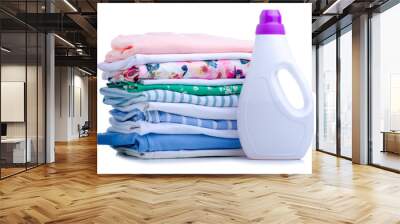 Stack folded cloth laundry with bottle liquid powder detergent on white background isolation Wall mural