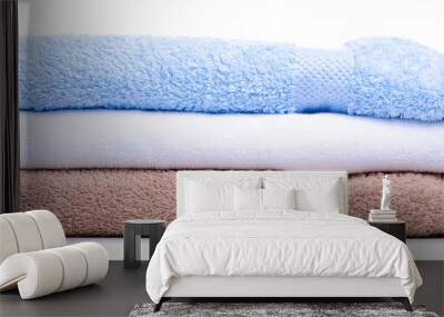 Stack of folded towels on white background isolation Wall mural