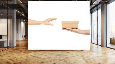 Two hands taking a box gift on white background isolation Wall mural