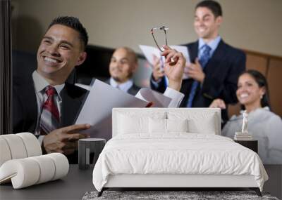 hispanic business people in boardroom smiling Wall mural