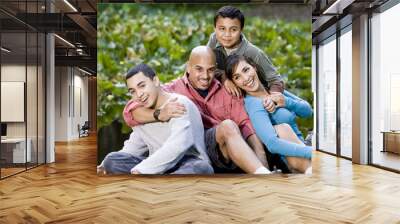 portrait of hispanic family with two boys outdoors Wall mural