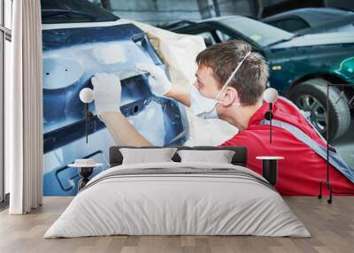 auto repairman grinding automobile body Wall mural