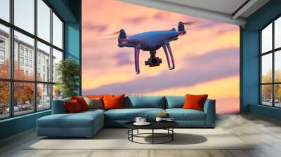 drone quadcopter with digital camera flying at sunset Wall mural