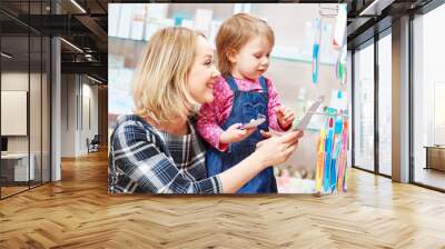 family in drug store. Mother and child Wall mural