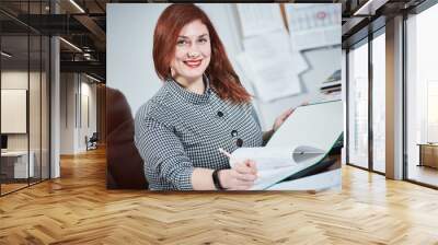 female accountant with documents in office. Accounting and tax service. Wall mural