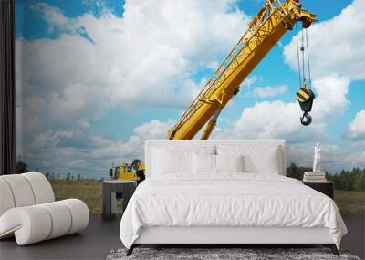 mobile crane with risen boom outdoors Wall mural