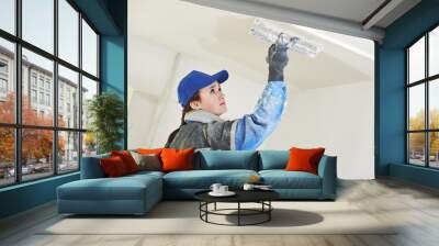 Plasterer at indoor ceiling work Wall mural