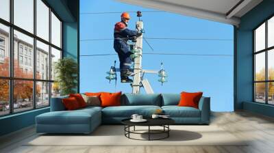 power electrician lineman at work on pole Wall mural