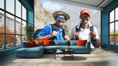 two smiling tourist hiker in india mountains Wall mural