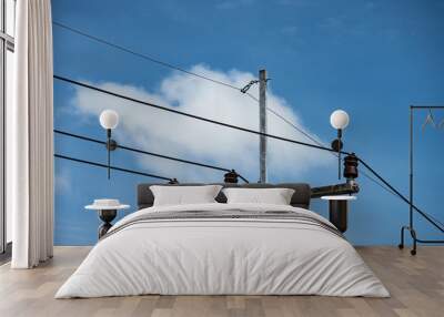 electric wire  on electrical pole with blue cloudy sky background Wall mural