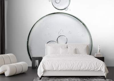 water bubbles floats or cosmetic liquid serum drops on white background. skin care concept Wall mural