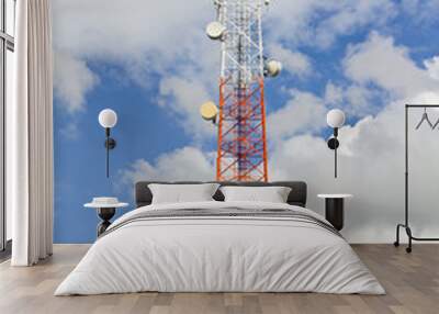 Telecommunication mast with cloudy sky. Wall mural