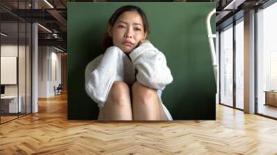 trouble tired negative asian woman sitting on chair worried problems thoughtful alone in room.unhapp Wall mural