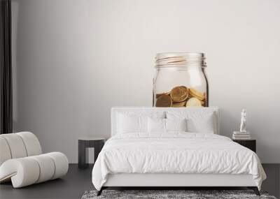 Savings jar with gold coins, wealth idea, financial concept
 Wall mural