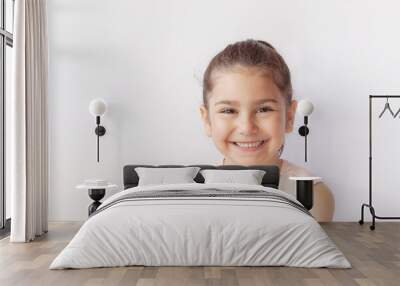 Portrait of a happy smiling child girl. Wall mural