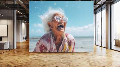 Senior woman laughing on the beach. Smiling happy lady enjoying a sunny day. Happiness, freedom, carefree concept. Generative AI. Wall mural