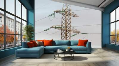 high electric iron tower with wires in the sky covered with clouds Wall mural