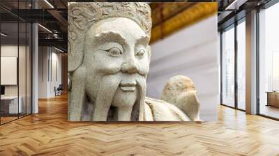 stone statue of an ancient warrior with a long mustache, the traditional art of decorating temples in Asia Wall mural