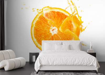 Fresh slide half of ripe orange fruit with orange juice splash water isolated on white background Wall mural