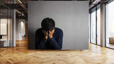 Man making facepalm gesture, sad and depression gesture Wall mural