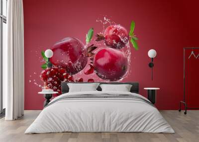 Ripe pomegranate fruit on red background. Wall mural