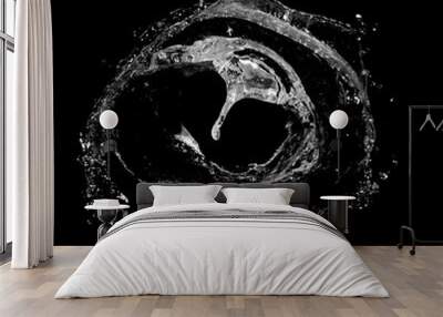 Water splashing isolated over a black background. Wall mural